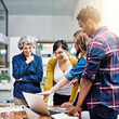 © Diane M/peopleimages.com - Laptop, diversity and designer team laughing at meme on social media or planning collaboration together at a startup. internet, strategy and small business group of employees streaming joke on news