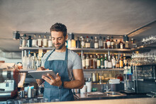 Man In Restaurant, Tablet And Small Business With Inventory Check, Entrepreneur In Hospitality Industry And Connectivity. Male Owner, Scroll And Cafe Franchise With Digital Admin And Stock Taking