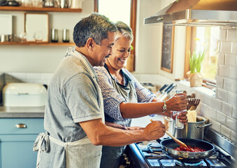 Poster - Help, cooking together and old couple in kitchen with smile, health and frying healthy food at stove. Love, senior man helping happy woman prepare lunch and meal in pan, retirement and dinner in home