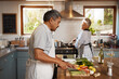 © Tamani Chithambo/peopleimages.com - Cooking, vegetables and old man with woman in kitchen, happiness and healthy bonding time in home. Marriage, love and food, senior couple with meal prep for vegetable dinner with retirement wellness.