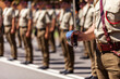 © Austockphoto - Australian army soldier with sword drawn for Freedom of Entry ceremony beside troops