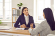© Studio Romantic - Two women meeting in the office. HR manager talking to a candidate at a job interview. Young business advisor, loan broker or lawyer discussing something with her client
