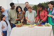 © Sabrina - Happy multigenerational people having fun together preparing barbecue dinner at house terrace rooftop - Multiracial friendship concept