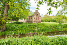 The Ruins Of The 12th Century Norman Chapel Beside The Moat Of Lower Brockhampton Manor House Near Bromyard, Herefordshire, England UK