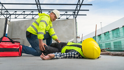 Wall Mural - Construction site workers fall from heights, scaffolding with construction supervision engineers hurrying to help first aid in the first place Accidents at work.