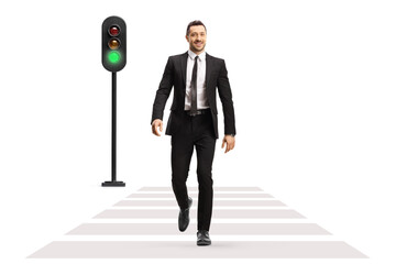 Poster - Full length portrait of a businessman crossing street at green traffic light