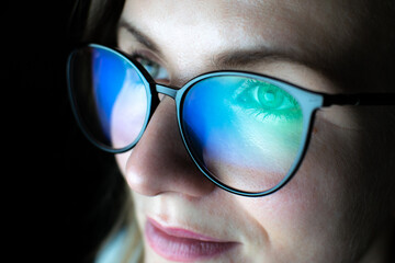 business woman in glasses is working online at the laptop or computer. social media influencer creat