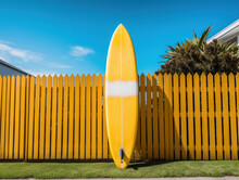Surfboard Against Wooden Fence