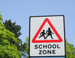 Close-up of a warning sign to notify traffic that they are entering a school zone