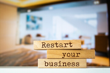 Wall Mural - Wooden blocks with words 'Restart your business'.