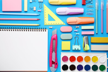 Wall Mural - Different school stationery on light blue background, flat lay. Back to school