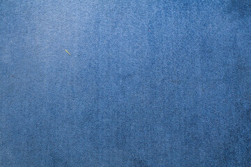 Blue carpet texture for background for interior design.  Close-up of gradient light.  Felt material macro. Close-up of abstract fabric.