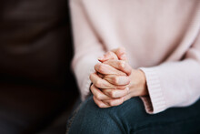 Woman, Hands Together And Grief Closeup With Stress And Anxiety In Therapy For Psychology Crisis. Pray, Mental Health Problem And Hand Of A Female Patient Scared With Depression At Counseling On Sofa