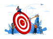 © FAHMI - Reaching targets, achieving goals or success in business, teamwork in achieving targets or goals. aim to hit target bullseye concept, business team with arrows stuck on big target.