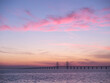© FOLIO - Oresund Bridge and sea at sunset in Malmo, Sweden
