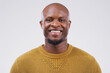 © Andrew G/peopleimages.com - Portrait, smile and black man with confidence, wellness and casual outfit against grey studio background. Face, male person and guy with happiness, carefree and joyful with mockup, beauty and fashion