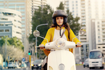 Woman, motorbike and transport in city, street and safety with helmet, journey or travel in summer sunshine. Girl, motorcycle and outdoor in metro for transportation, vacation and freedom on road