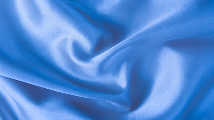 abstract blue silk fabric texture background. creases of satin
