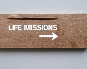 Wood with inscription text direction sign point to LIFE MISSIONS, means key aspects of life that make worth living to fulfill a goal or passion