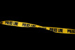 © Sanit - Do not cross police line tape yellow isolated on black background. This has clipping path.