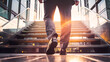 Businessman climbing stairs with sunlight ahead. Business person, professional-looking entrepreneur with legs and shoes close up. Career development and success concept. Ai generated 