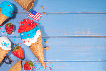 Wall Mural - Red, white and blue ice cream balls. Patriotic USA lollypops ice cream for july 4 party or bbq picnic, tasty summer dessert with fruit berry flavours, with waffle cones