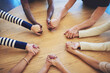 © Tamani Chithambo/peopleimages.com - Circle, group and holding hands with people, pray and support for faith, trust or solidarity on desk. Teamwork, helping hand and together with praying, religion or gratitude with mindfulness on table