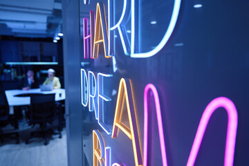 Work hard dream big neon sign in the office