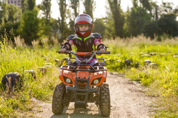 Girl riding an electric quad bike