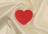 Fototapeta Kawa jest smaczna - Beige white pearl wave silk fabric with heart frame card. Abstract texture horizontal copy space background.