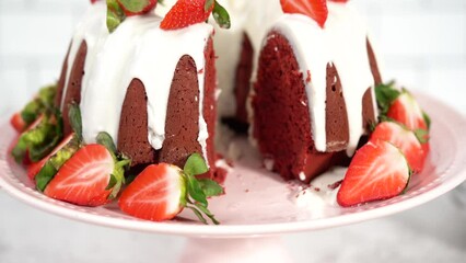 Sticker - Step by step. Slicing red velvet bundt cake with cream cheese frosting garnished with fresh strawberries.