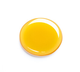 beautiful drop of honey or other yellow liquid isolated on white background. yellow or orange drop o