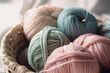 Leinwandbild Motiv Close Up of yarn balls. Pastel colors. Yarn for knitting. Big Skeins of yarn. Knitting needles, colorful threads. Knitting wallpaper background. Generative AI professional photo imitation.