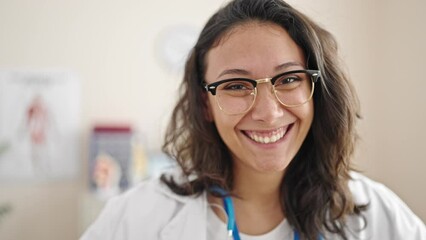 Sticker - Young beautiful hispanic woman doctor smiling confident standing at clinic