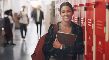 Poster - Portrait, education and books with a student girl by her locker in the hallway of her school. Learning, university and scholarship with a college pupil holding a notebook for studying knowledge