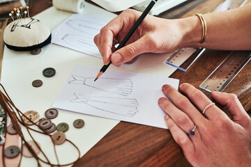 Woman, hands and fashion design drawing for planning, idea or sketching on office desk above. Hand of creative female person, artist or graphic designer for clothing sketch, ideas or startup on table