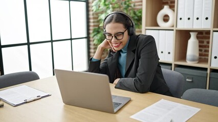 Sticker - Young beautiful hispanic woman business worker using laptop wearing headset at office