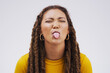 Portrait, funny face and tongue with a black woman joking in studio on a white background for humor. Comic, comedy and braids on eyes with a playful young female person eyes closed for an emoji