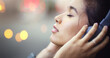 © Andrew G/peopleimages.com - Woman with headphones in city, peace and listening to music, freedom and technology outdoor. Mockup space, podcast or radio streaming with satisfied female person in urban street and audio playlist