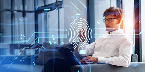 Poster - businessman finger touch fingerprint hologram with laptop on sofa