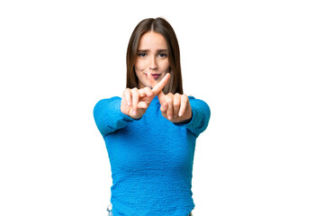 Young beautiful woman over isolated chroma key background making stop gesture with her hand to stop an act