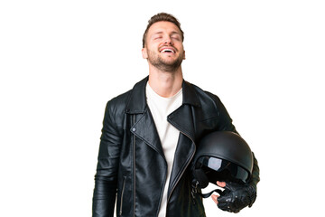 Wall Mural - Young caucasian man with a motorcycle helmet over isolated chroma key background laughing