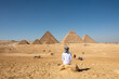 Person in the desert of Giza Pyramids