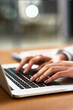 © Jadon B/peopleimages.com - Laptop, keyboard and hands of a person at desk for work, internet and connection at night. Business, closeup and a secretary or receptionist typing on a computer for late admin online in an office