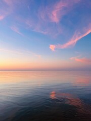 Wall Mural - Beautiful tender sky reflection on the sea surface, blue and purple sky after the sunset, glance sea surface 