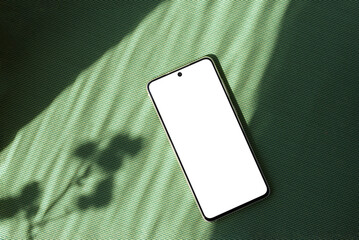 minimalist summer business brand template, blank mobile phone screen mock up on bright green textile
