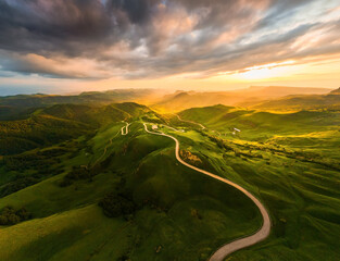 Wall Mural - View of the green mountains at sunset. Gumbashi Pass in North Caucasus, Russia