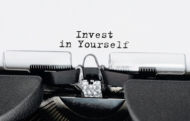 Aufkleber - Text invest in yourself typed on retro typewriter