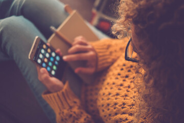 above view of woman alone using mobile phone app gadget touching display. online social media lifest