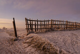 Fototapeta Morze - A Clent Hills Worcestershire winter scene with cold wooden fence